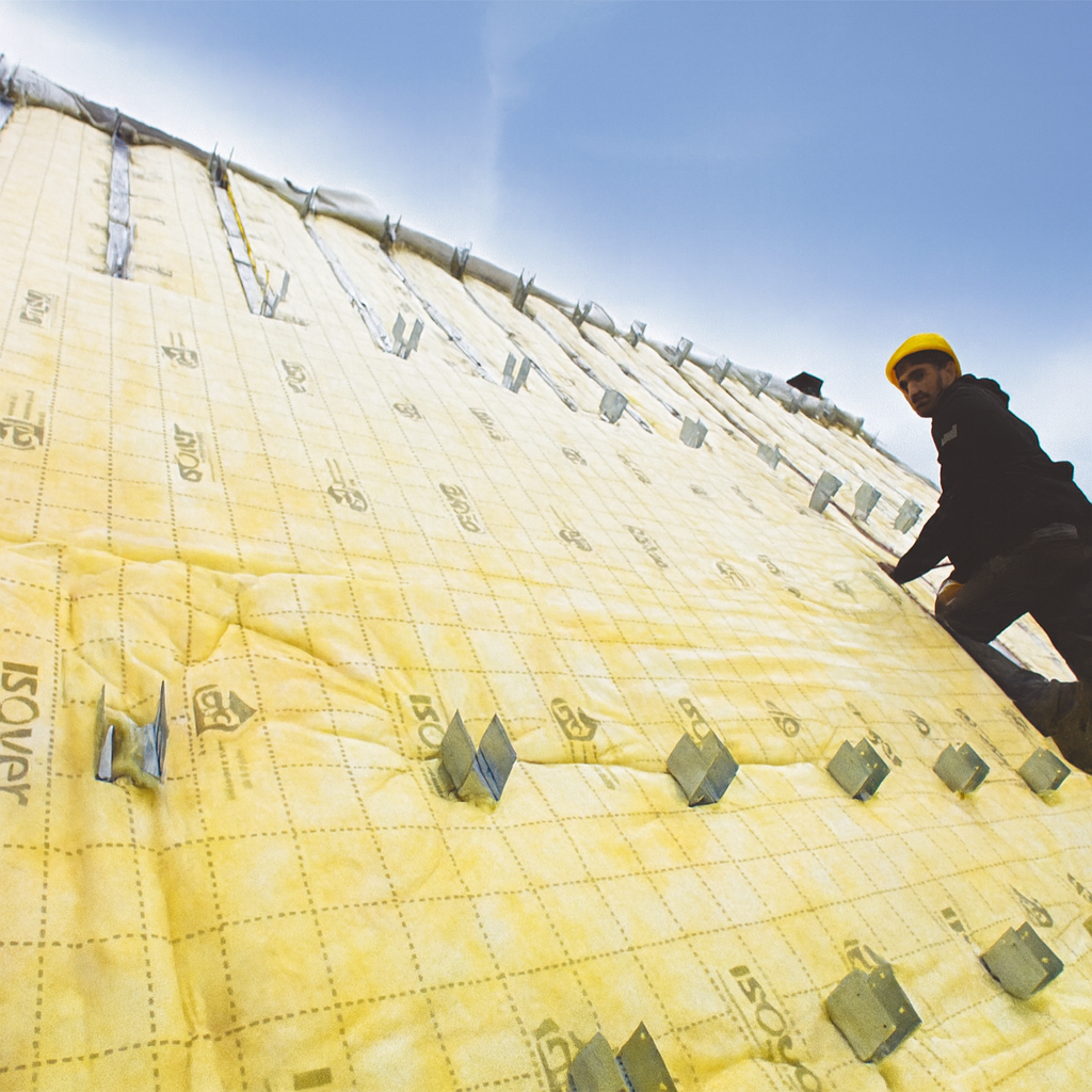 isolation à la laine de vers d'une toiture par l'extérieur